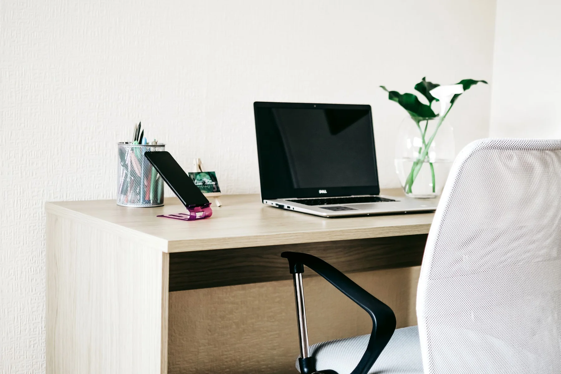 Photograph of a laptop on a desk
